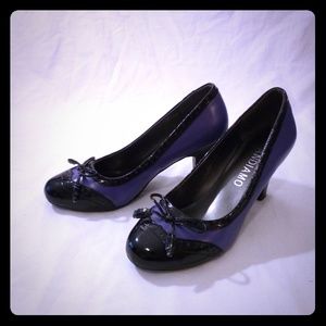 Purple wing tip style heels.